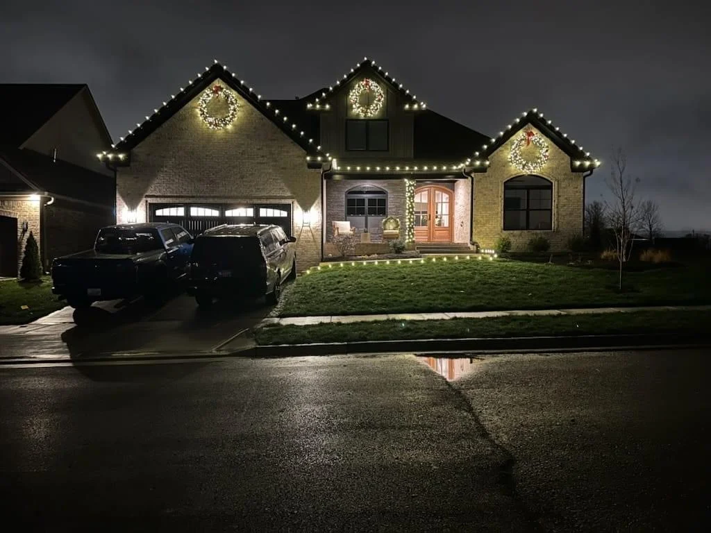 Three glowing wreaths and an illuminated pathway