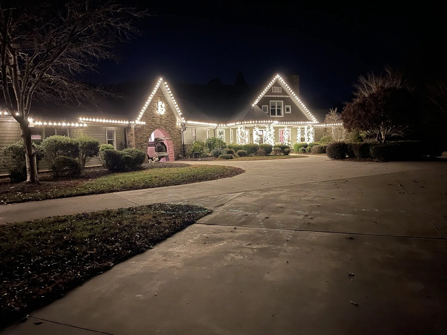 Warm white Christmas roofline lighting installed on a Salisbury, NC home by Little Elves Lighting Pros